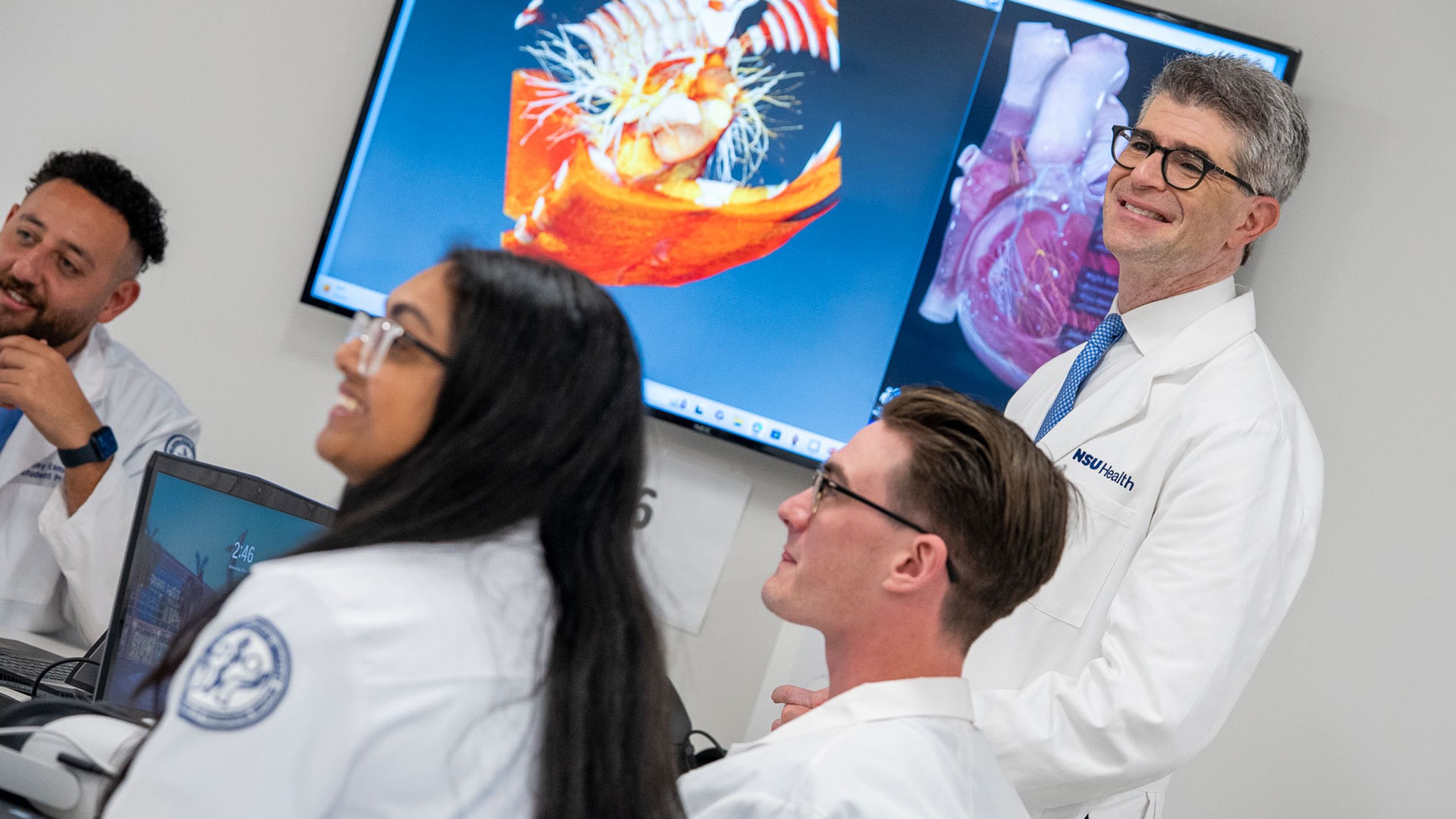 Dr. Perlyn with students in a lab