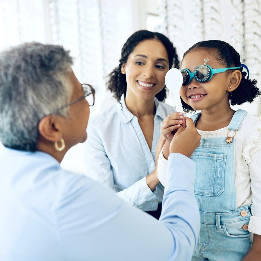 image of young girl getting an eye exam