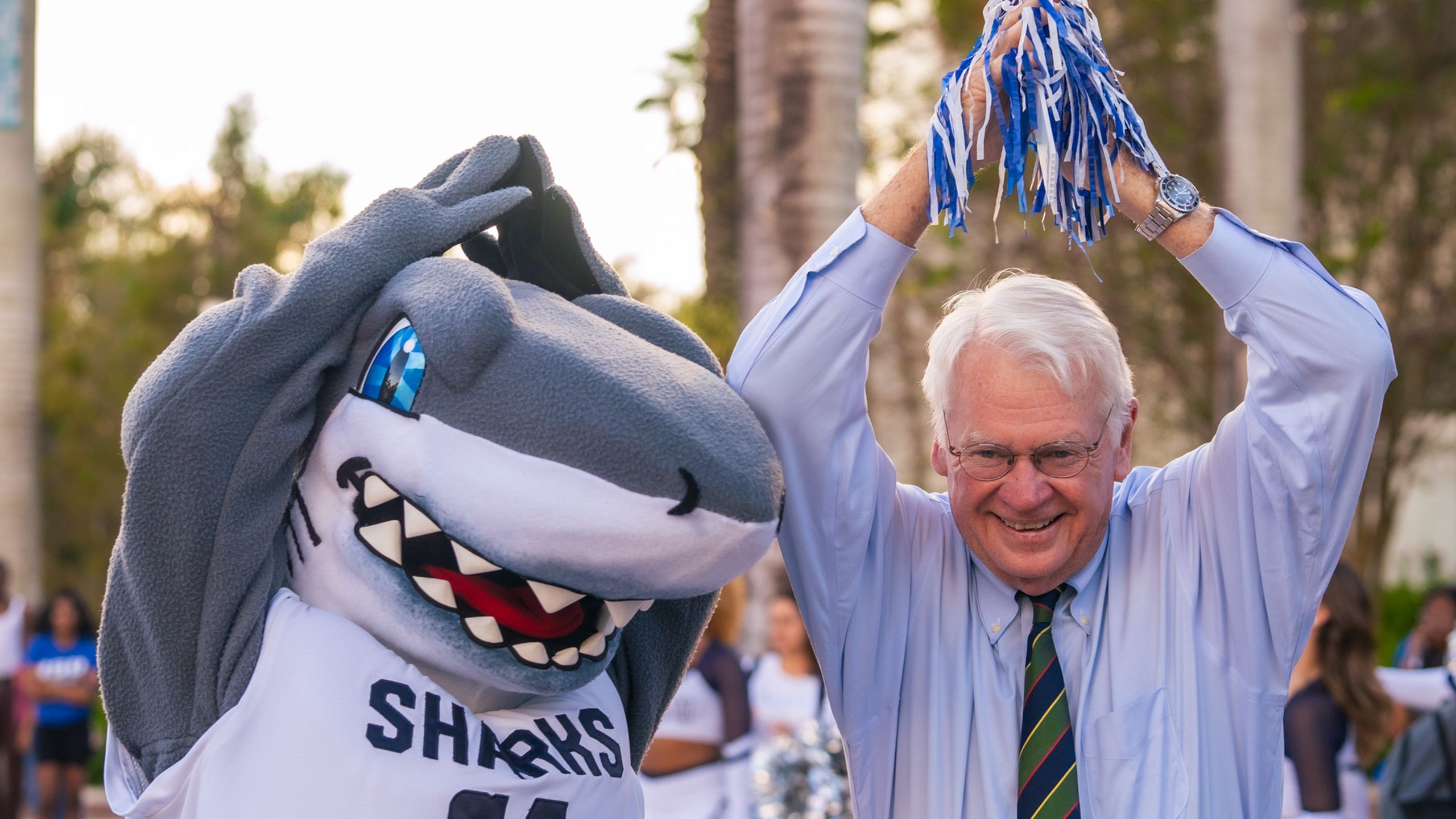 Dr. Moon with the NSU shark mascot at the 2023 homecoming parade